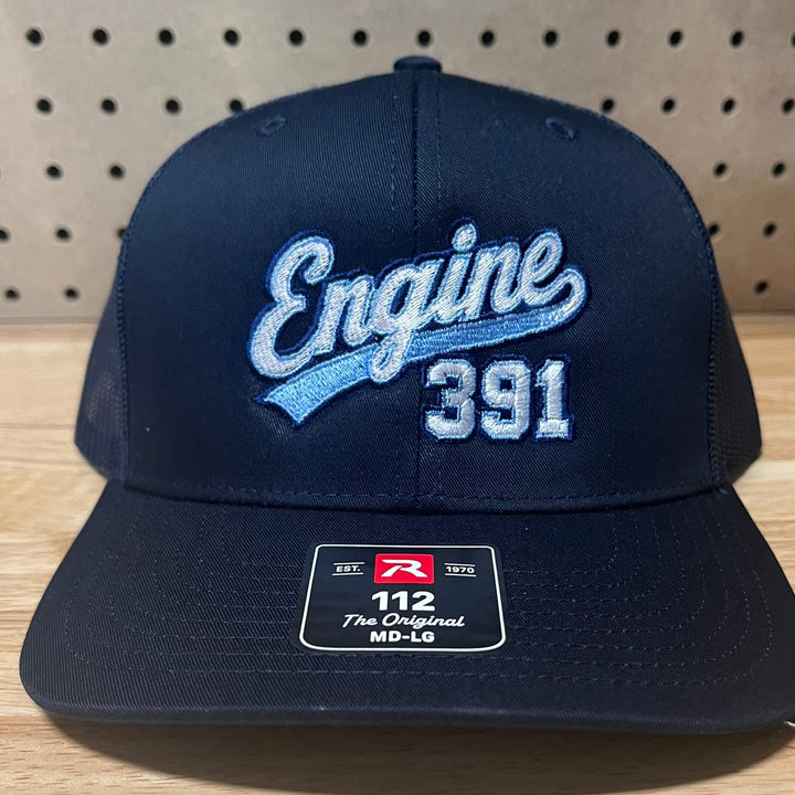 Embroidered fire department engine company logo on a navy Richardson 112 trucker hat