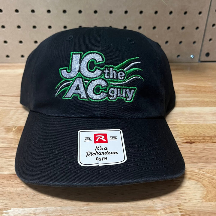 Embroidered air conditioning company logo on a black unstructured dad hat