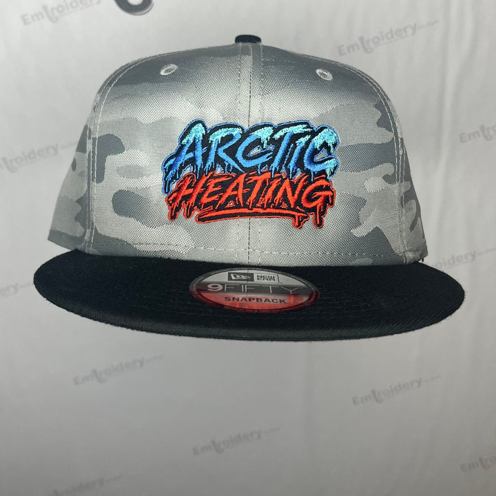 Embroidered heating company logo on a grey camo flat bill snapback with a black bill