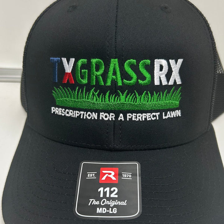 Embroidered lawn care company logo on a black Richardson 112 trucker hat