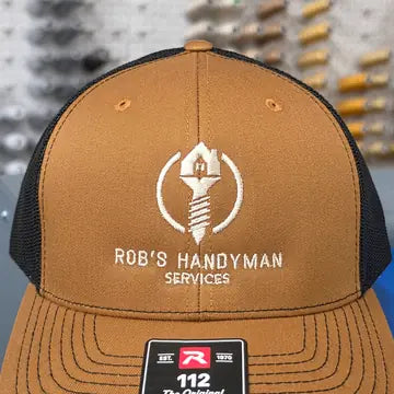 Proof photo 3 of 128: a customer logo stitched on a test hat